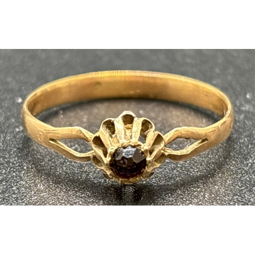 1145 - A vintage 9ct gold ring with high mount set with a single round cut garnet. Split shoulders and plai... 