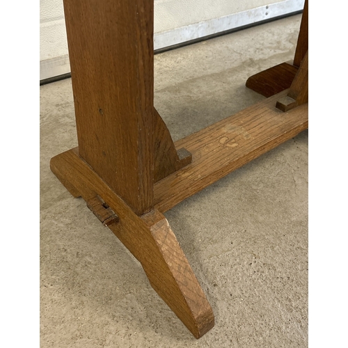 1437 - An Arts & Crafts light oak swivel top drop leaf occasional table with wedge feet. Approx. 75.5cm tal... 