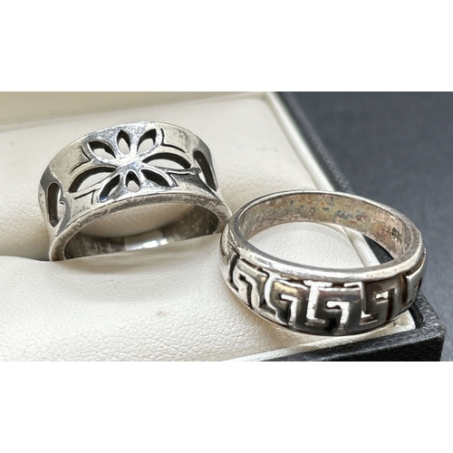 1151 - 2 pierced work design silver band rings, a floral and heart design together with a Greek key design.... 