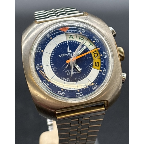 A vintage 1970's men's Regatta Yachttimers 7737 wristwatch by Mamosail. With stainless steel square case and strap. Blue, white and yellow face with orange luminous stopwatch hand. Some cracks to glass and wear to stainless steel case. In working order.