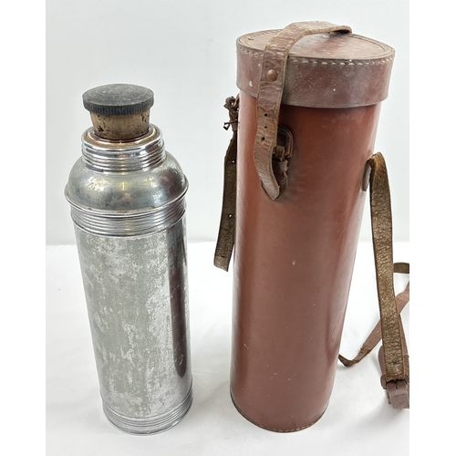 1389 - An early 20th century chrome Thermos vacuum flask in brown leather carry case with shoulder strap. F... 