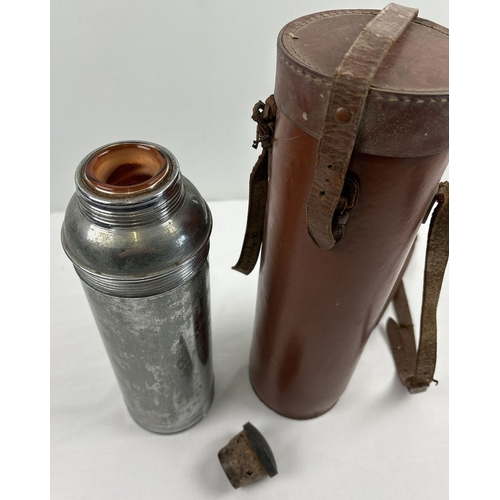 1389 - An early 20th century chrome Thermos vacuum flask in brown leather carry case with shoulder strap. F... 