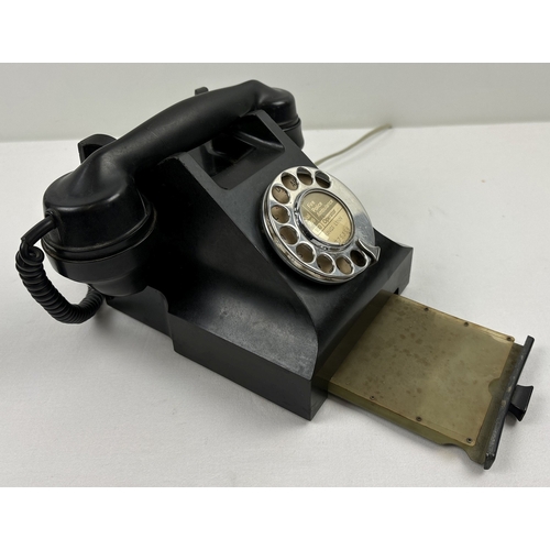 1400 - A vintage black bakelite GPO rotary telephone 164 48 with coil handset cord and pull out index plate... 