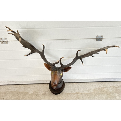 1401 - A Carved wooden wall hanging deer/moose head with hand painted detail, glass marble set eyes and rea... 