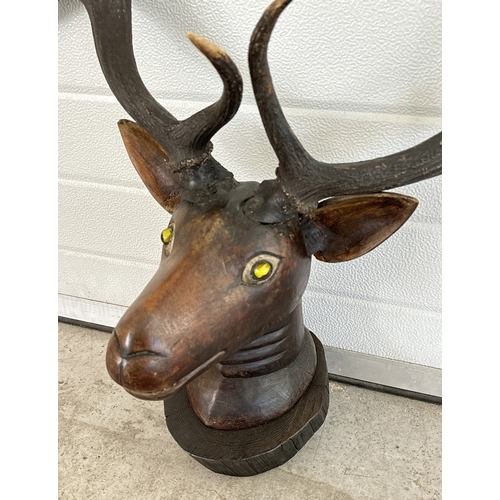 1401 - A Carved wooden wall hanging deer/moose head with hand painted detail, glass marble set eyes and rea... 