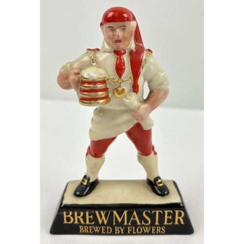 1357 - A vintage Wade ceramic advertising bar ornament for Brewmaster by Flowers brewery. Approx. 13.5cm ta... 