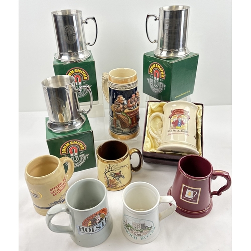 1358 - A collection of 10 assorted ceramic and metal tankards, mostly advertising, to include boxed limited... 