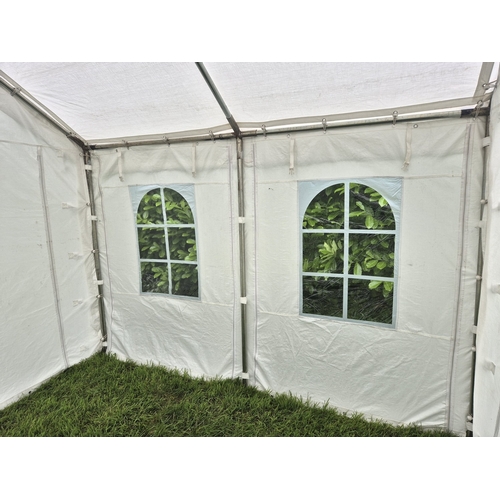 1403 - A superior quality party tent/marquee, 3m x 3m. 5 waterproof sheets (4 sides & top), 2 side sheets h... 