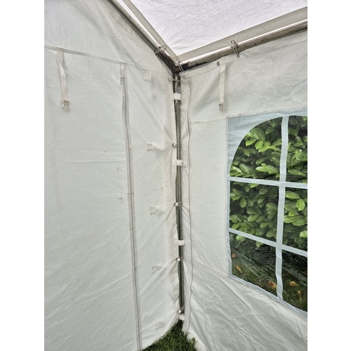 1403 - A superior quality party tent/marquee, 3m x 3m. 5 waterproof sheets (4 sides & top), 2 side sheets h... 