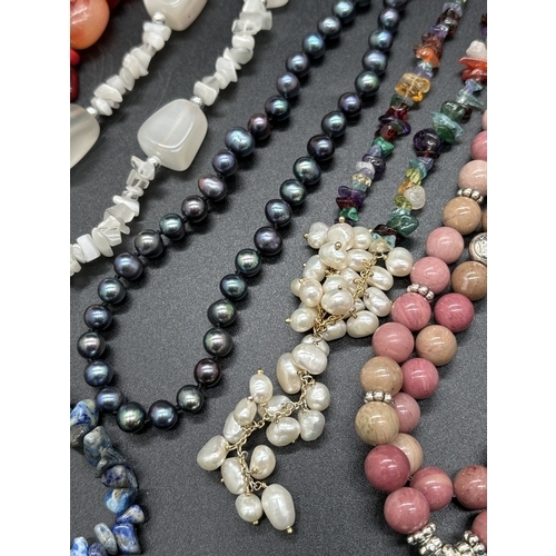 1084 - A collection of natural semi precious stone and freshwater pearl jewellery necklaces and bracelets. ... 