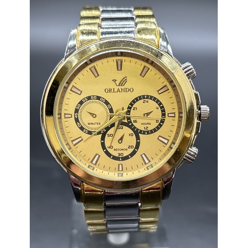 1196 - A Men's Y1376 chronograph style wristwatch by Orlando. Silver and gold tone stainless steel strap an... 