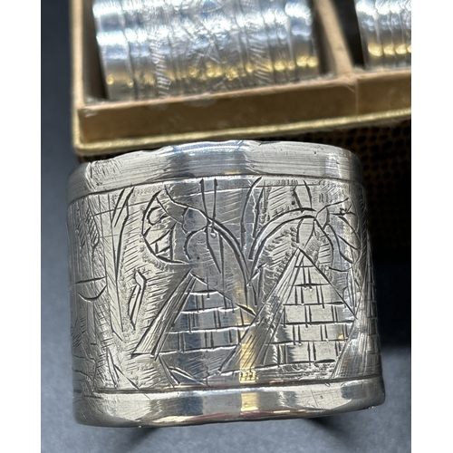 1209 - 4 vintage Egyptian silver serviette rings. A boxed matching pair with plaited design, a single ring ... 