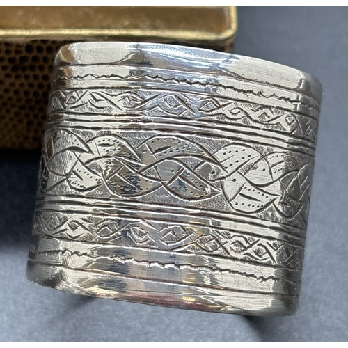 1209 - 4 vintage Egyptian silver serviette rings. A boxed matching pair with plaited design, a single ring ... 