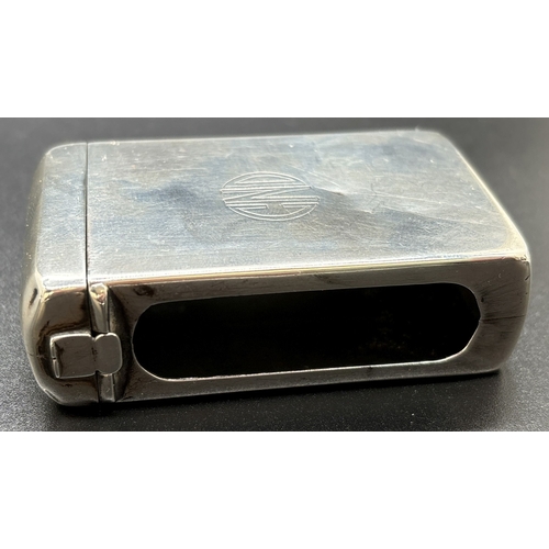 1215 - An Art Deco silver matchbox case with hinged lid, open side panels and engraved circular monogram CN... 