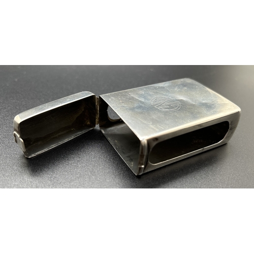 1215 - An Art Deco silver matchbox case with hinged lid, open side panels and engraved circular monogram CN... 