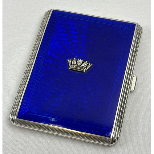A vintage silver cigarette case with royal blue guilloche panel and embossed with the Navy crown. Art Deco design stepped sides decorated with diapered pattern, continuing onto reverse. Fully hallmarked inside gilt interior (both sides) for Birmingham 1940, with John William Barrett makers mark, and engraved "Jane from Frances, April 1948". Approx. 8.5 x 7cm, total weight approx. 118.4g.