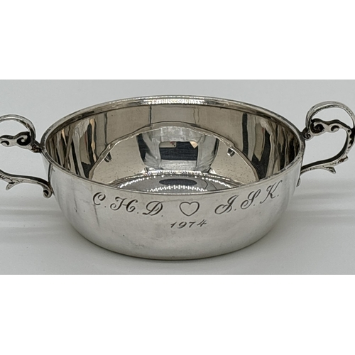 1221 - A vintage 1970's silver 2 handled flat bottomed cup or quaich with decorative looped handles. Engrav... 