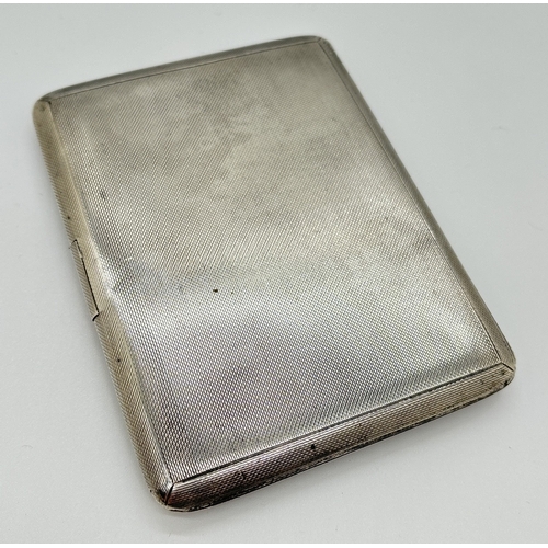 1228 - A vintage Goldsmiths & Silversmiths Co Ltd silver cigarette case with striped guilloche panel and em... 