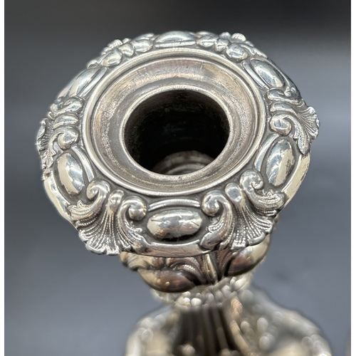 1229 - A pair of Matthew Bolton Georgian silver plated candlesticks with scroll, foliate and shell decorati... 