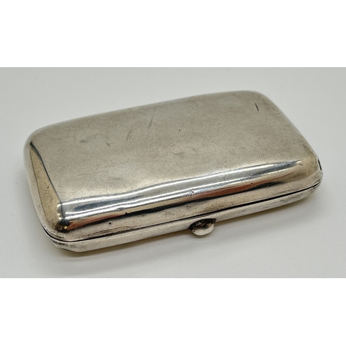 1231 - A small Edwardian silver curve backed cigarette case with gilt interior and original elastics. Hallm... 