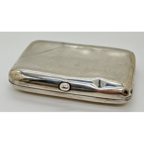 1231 - A small Edwardian silver curve backed cigarette case with gilt interior and original elastics. Hallm... 