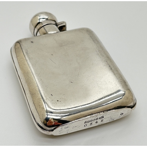 1232 - A vintage silver plated curve backed hip flask with engraved initials C.H.D. Hinged lid with cork li... 