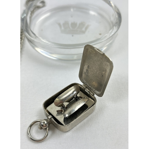 1241 - 3 small vintage collectables. A silver plated cased monogram ink stamp fob, a glass dish with engrav... 