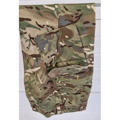 1253 - 3 items of British Army Military issue clothing, as new. A pair of warm weather MTP combat trousers ... 