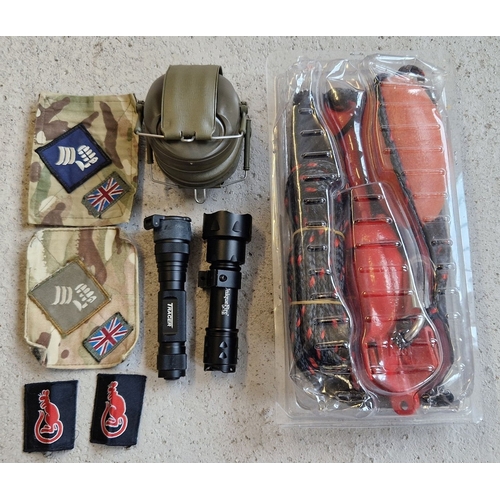 1258 - A collection of assorted military accessories & badges, some as new. A Unique Fire UF-T20 infrared z... 