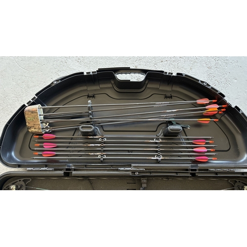 1264 - A Cased Bow Tech 101st Airbourne right hand compound bow with arrows and accessories. 8 field point ... 