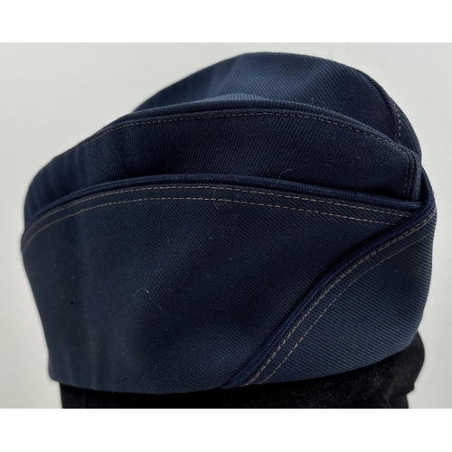 1266 - A vintage Kingform, New York, side cap in Navy blue with double stitched seams. Size 23.