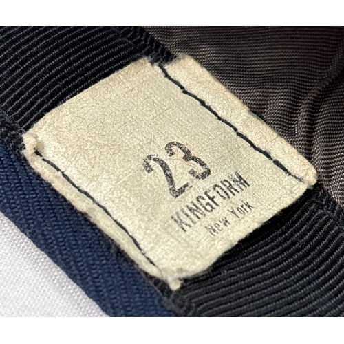 1266 - A vintage Kingform, New York, side cap in Navy blue with double stitched seams. Size 23.