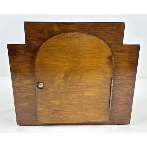 1268 - An Art Deco wooden cased westminster chime mantle clock with stepped design and inlaid panels. Pierc... 