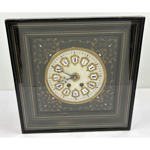 A 19th century Vineyard wall hanging clock By Orange A. Paris. Square ebonised wooden case with brass and mother of pearl inlaid surround. White marble face with ormolu back panels to enameled roman numerals hour markers. Ormolu central cartouche with blue steel hands. Marker name to No. 6 hour marker. 8 day movement which should chime on the hour and half hour. No Key so unable to advise if in working order. Comes with photocopy of work carried out in full restoration. Case approx. 38.5 x 38.5cm.