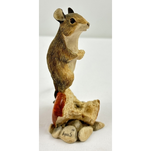 1283 - A Border Fine Arts figure of a field mouse sat eating on an apple core. Makers label to underside. F... 