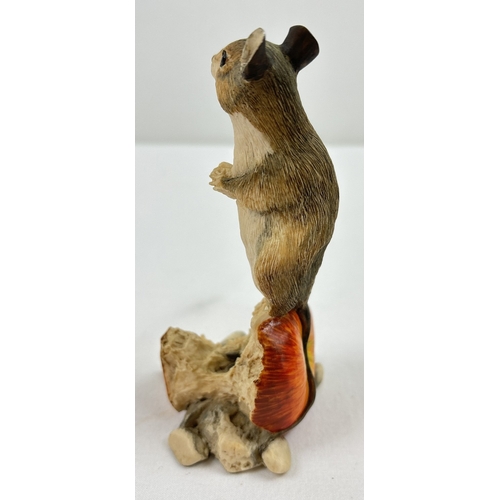 1283 - A Border Fine Arts figure of a field mouse sat eating on an apple core. Makers label to underside. F... 