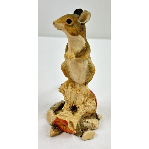 1283 - A Border Fine Arts figure of a field mouse sat eating on an apple core. Makers label to underside. F... 