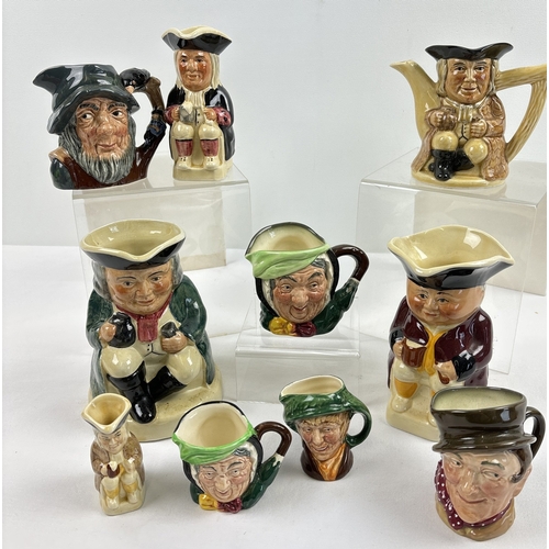 1289 - 10 assorted ceramic character jugs, mugs & teapot, by Royal Doulton and Tony Wood, in varying sizes.... 