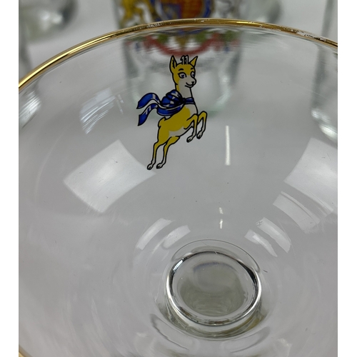 1295 - A collection of assorted mid century glasses, to include Babycham and royal commemorative. Lot compr... 