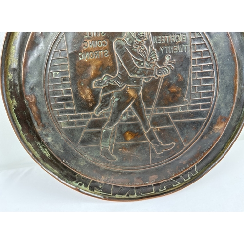 1311 - A vintage copper pub advertising tray for Johnnie Walker scotch whisky. Approx. 33.5cm diameter.