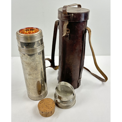 1388 - An early 20th century chrome Thermos vacuum flask in brown leather carry case with strap. Flask mark... 