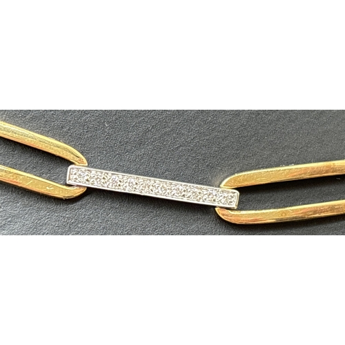 1041 - A 16 inch 18ct white and yellow gold alternating oval and flat link diamond set collar style necklac... 