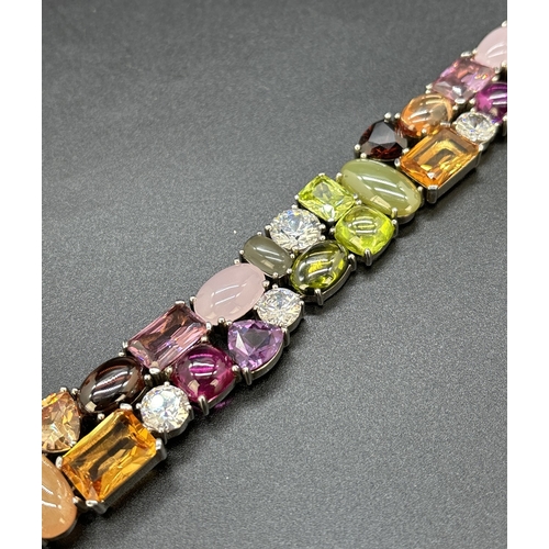 1100 - A 925 silver multi coloured stone set bracelet by Ti Sento, Milan. Bracelet set with 32 different cu... 