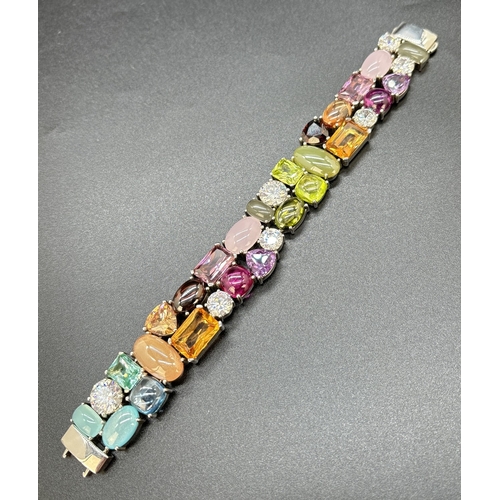 1100 - A 925 silver multi coloured stone set bracelet by Ti Sento, Milan. Bracelet set with 32 different cu... 