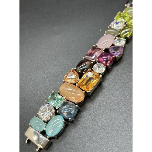 1100 - A 925 silver multi coloured stone set bracelet by Ti Sento, Milan. Bracelet set with 32 different cu... 