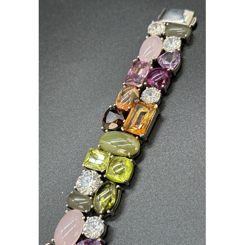 1100 - A 925 silver multi coloured stone set bracelet by Ti Sento, Milan. Bracelet set with 32 different cu... 