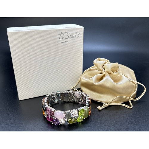 1100 - A 925 silver multi coloured stone set bracelet by Ti Sento, Milan. Bracelet set with 32 different cu... 