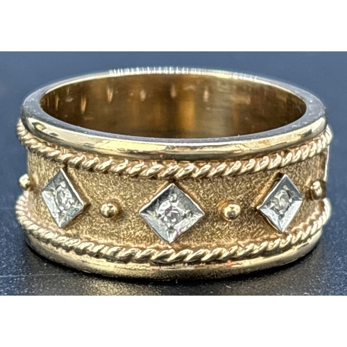 1110 - A brushed and plain 9ct yellow and white gold band ring set with 5 small diamonds. 8mm wide band wit... 