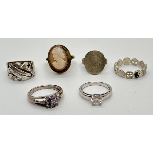 1141 - 6 silver and white metal rings in various designs and sizes. To include 800 silver cameo ring, tanza... 