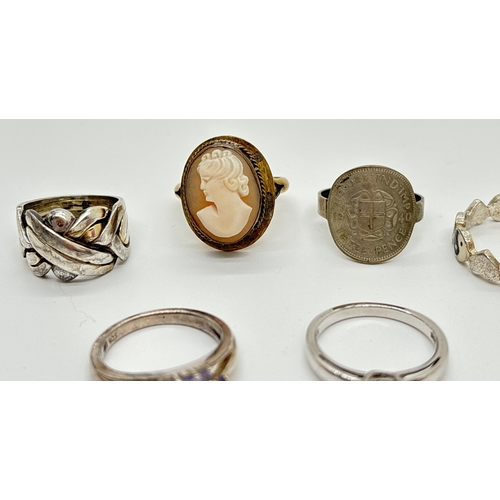 1141 - 6 silver and white metal rings in various designs and sizes. To include 800 silver cameo ring, tanza... 